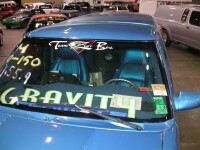 Custom-upholstered Corvette seats in the cockpit, SPL scores on the windshield, and TREO CSX subwoofers in a ported wall