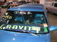 
Custom-upholstered Corvette seats in the cockpit, SPL scores on the windshield, and TREO CSX subwoofers in a ported wall