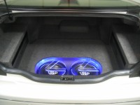 Two TREO SSi12 subwoofers in custom fiberglass enclosure with custom Lexus logo Plexiglass subwoofer grilles