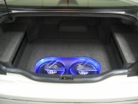 Two TREO SSi12 subwoofers in custom fiberglass enclosure with custom Lexus logo Plexiglass subwoofer grilles